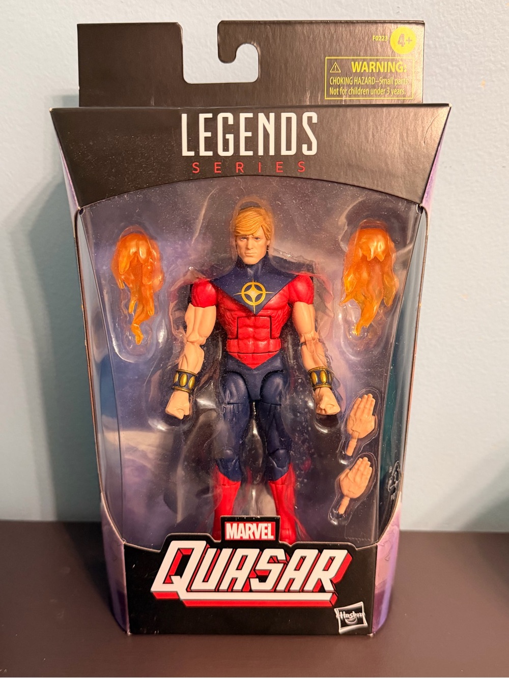 Marvel Legends Quasar Figure Packaging - Red, Blue & Gold Artwork